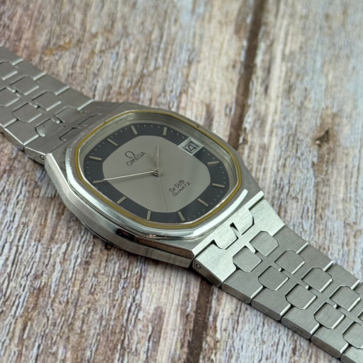 1970s Omega De Ville quartz men’s blue dial integrated bracelet wrist watch 35mm