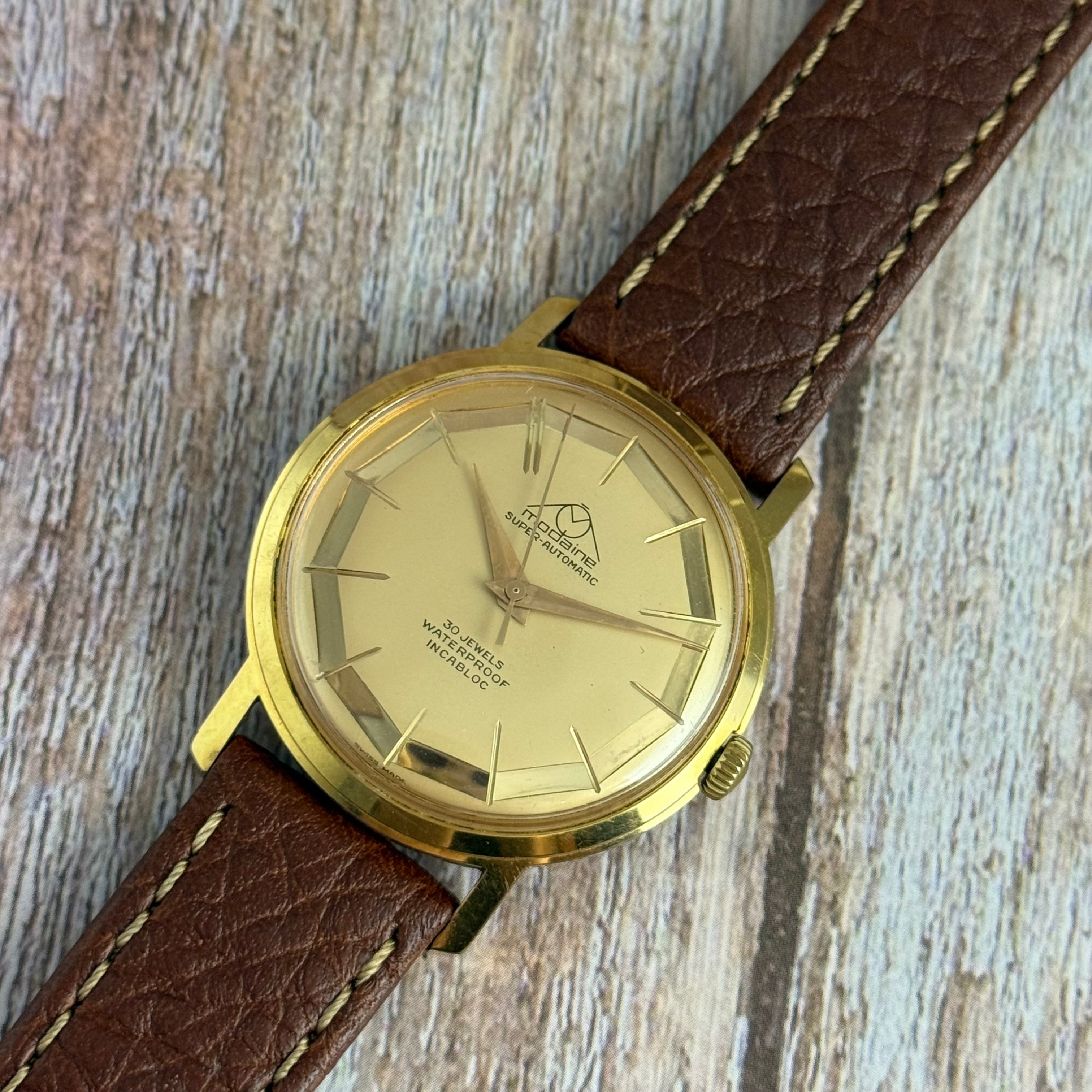 1970s Mondaine automatic “mirror web” dial men’s rose gold plated wrist watch 35mm