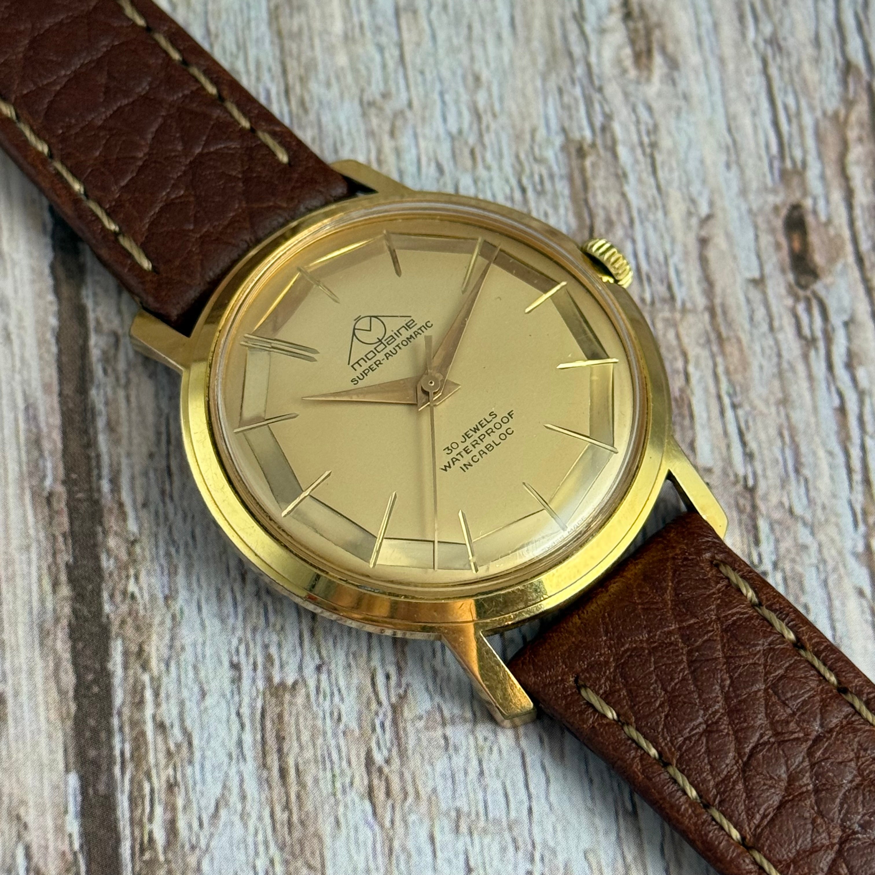 1970s Mondaine automatic “mirror web” dial men’s rose gold plated wrist watch 35mm